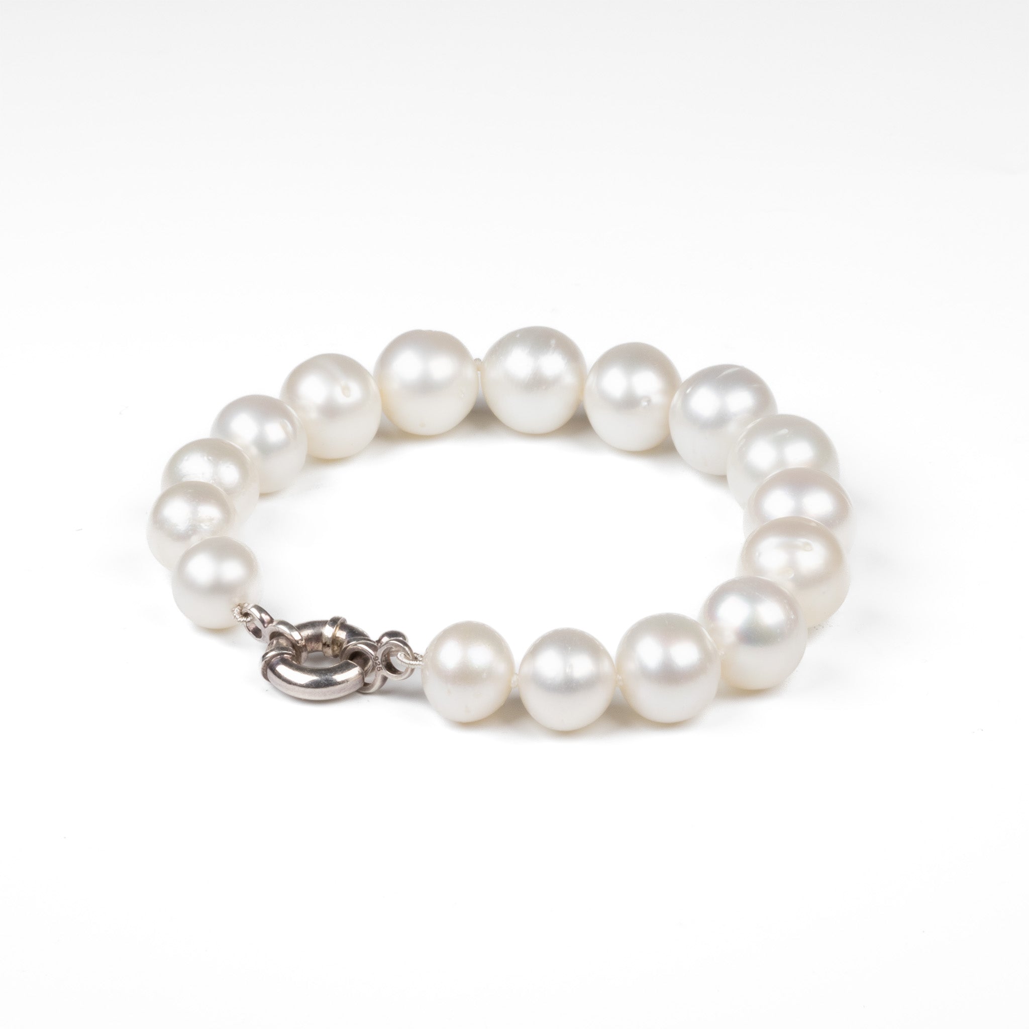 This Willie Creek Pearls bracelet is composed of 16 button-shaped, white South Sea pearls with excellent lustre set with a sterling silver clasp.