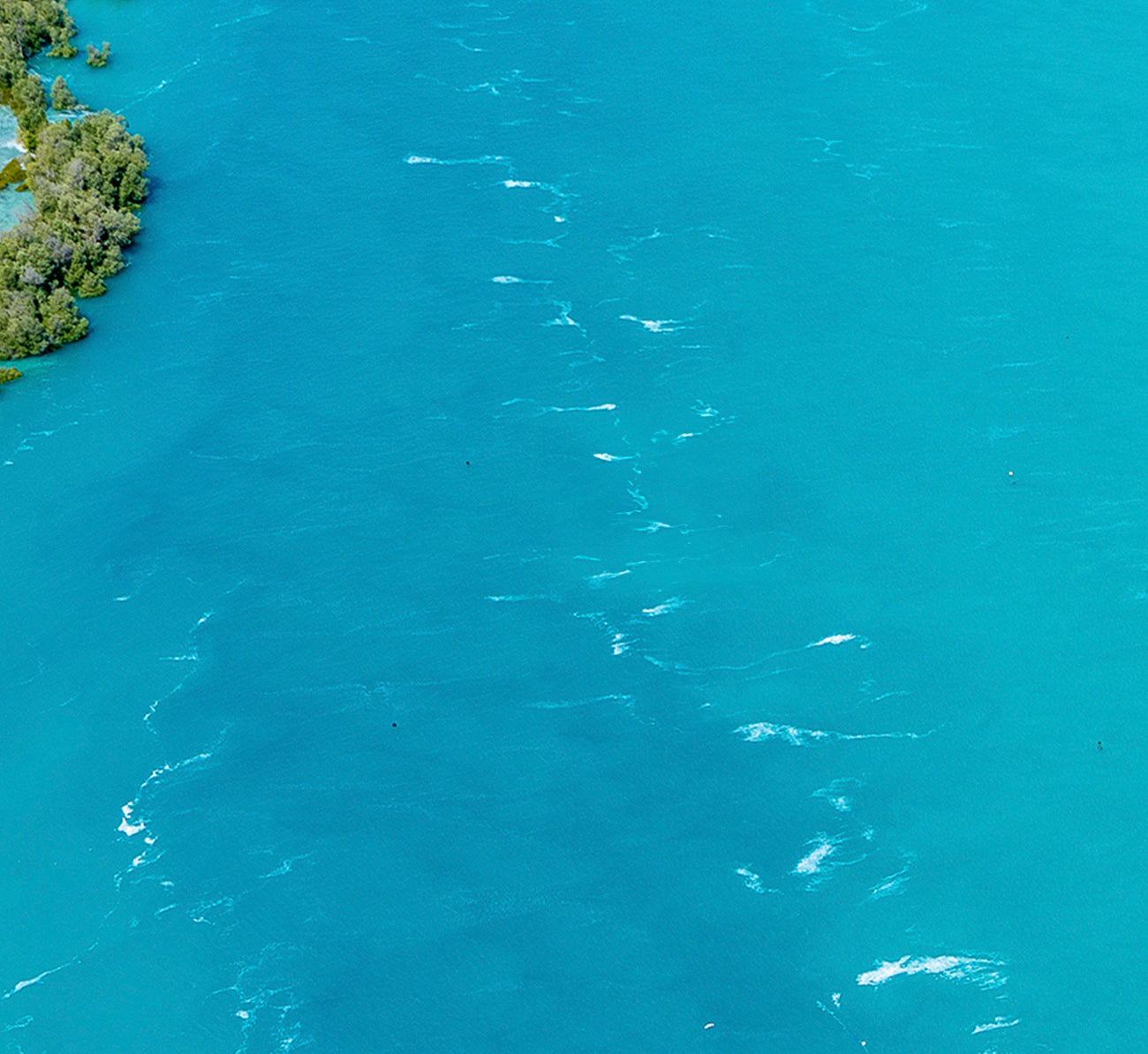 An aerial view of Willie Creek near Broome, showcasing the vibrant turquoise waters by the Willie Creek Pearl Farm.