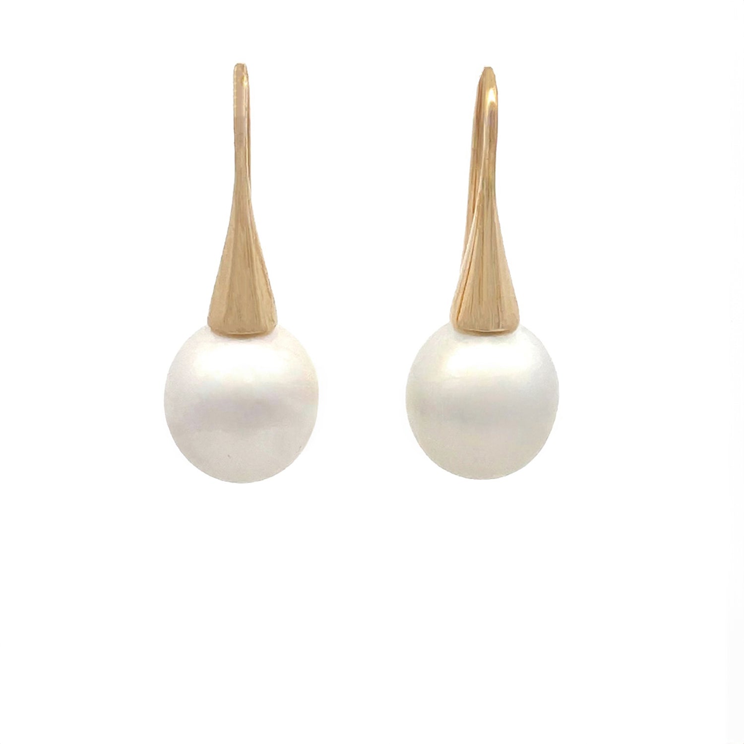 A pair of yellow gold Australian South Sea pearl hook earrings displayed against a white background.