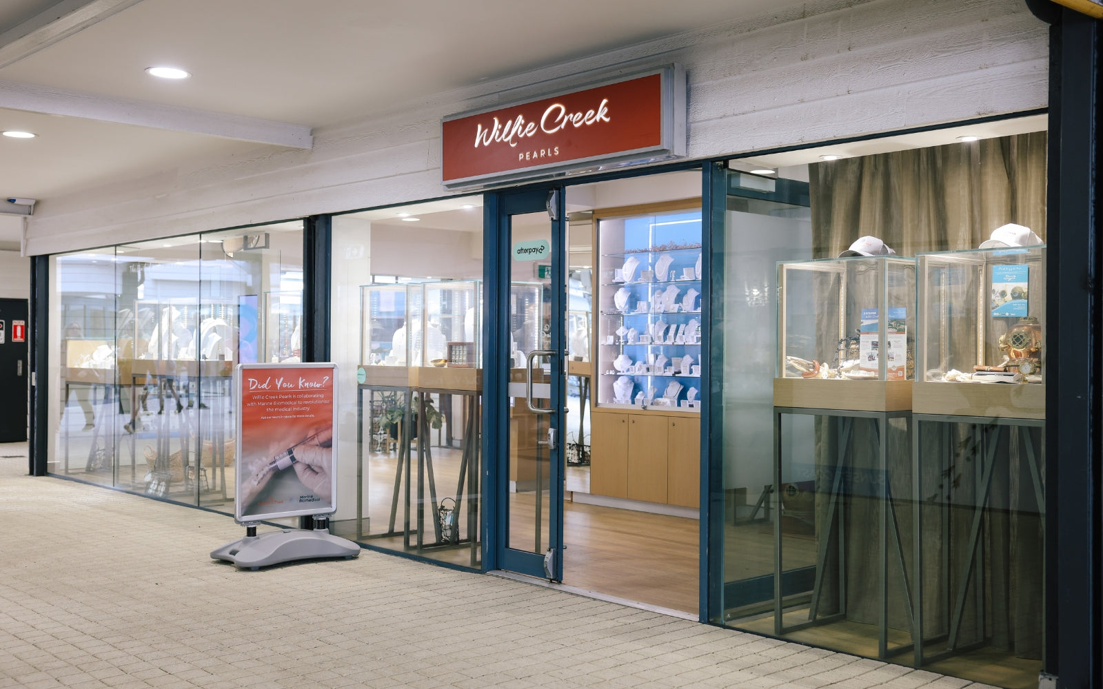 The exterior of the Willie Creek Pearls jewellery showroom at Hillarys Boat Harbour, featuring display cabinets showcasing Australian South Sea pearl jewellery.