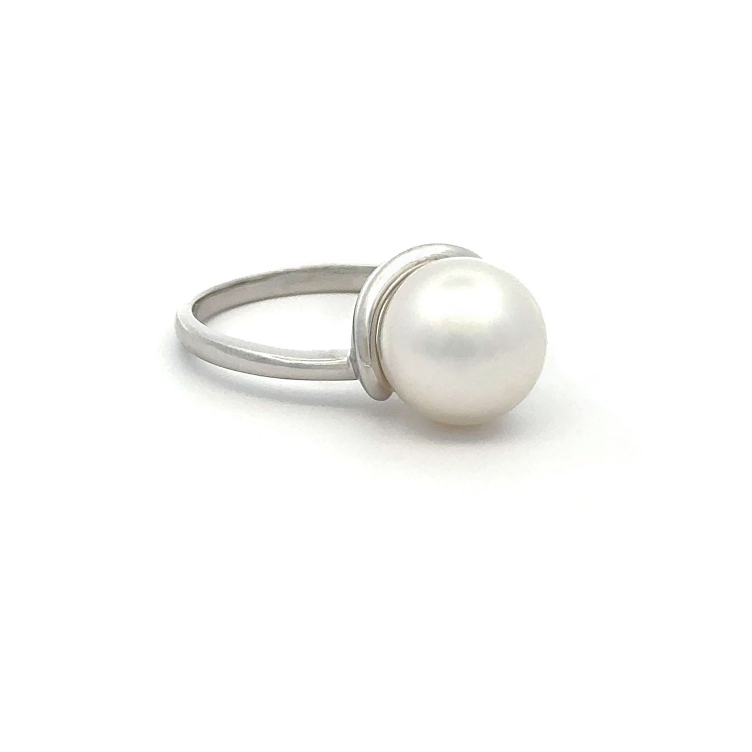 A white gold Australian South Sea pearl ring shown from a side angle against a white background.