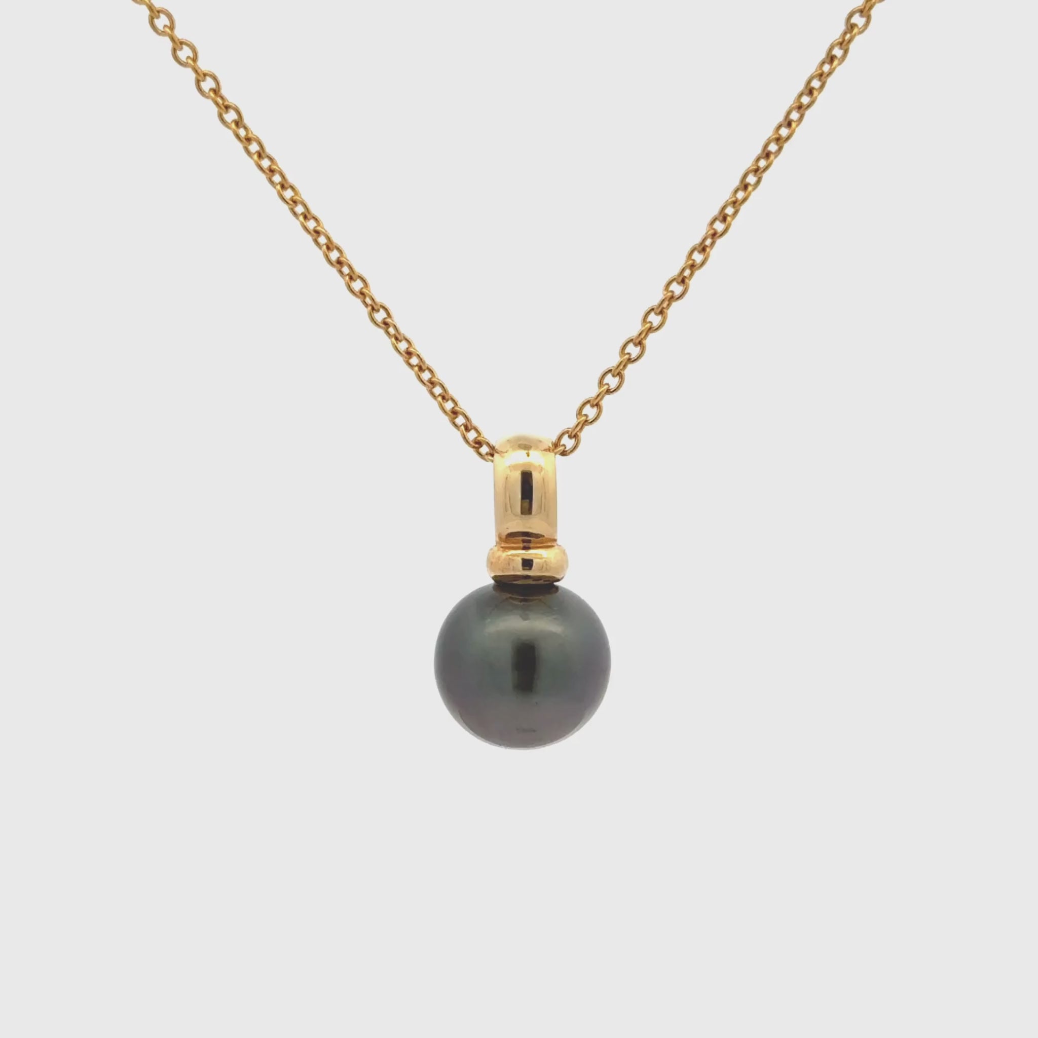 A luxurious piece that combines modern sophistication with the beauty of nature. This Willie Creek Pearls pendant is composed of 18K yellow gold, with a single 11-12mm off round, black pearl with excellent lustre. Chain sold separately.